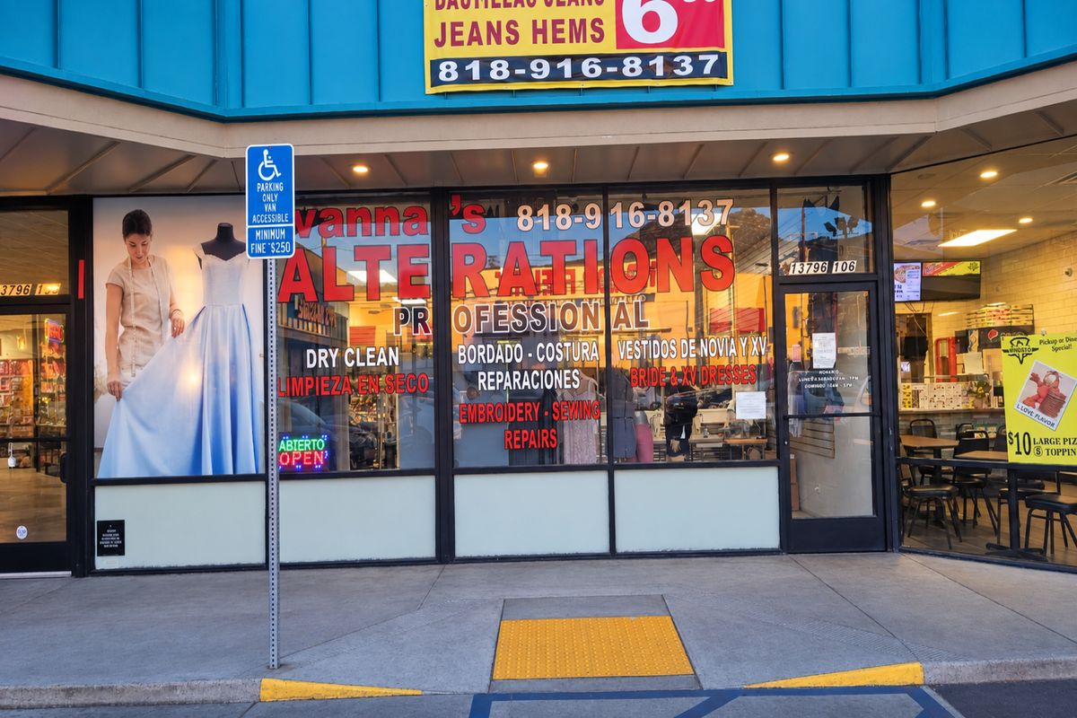 The shop at dusk on Foothill Blvd, windows lit